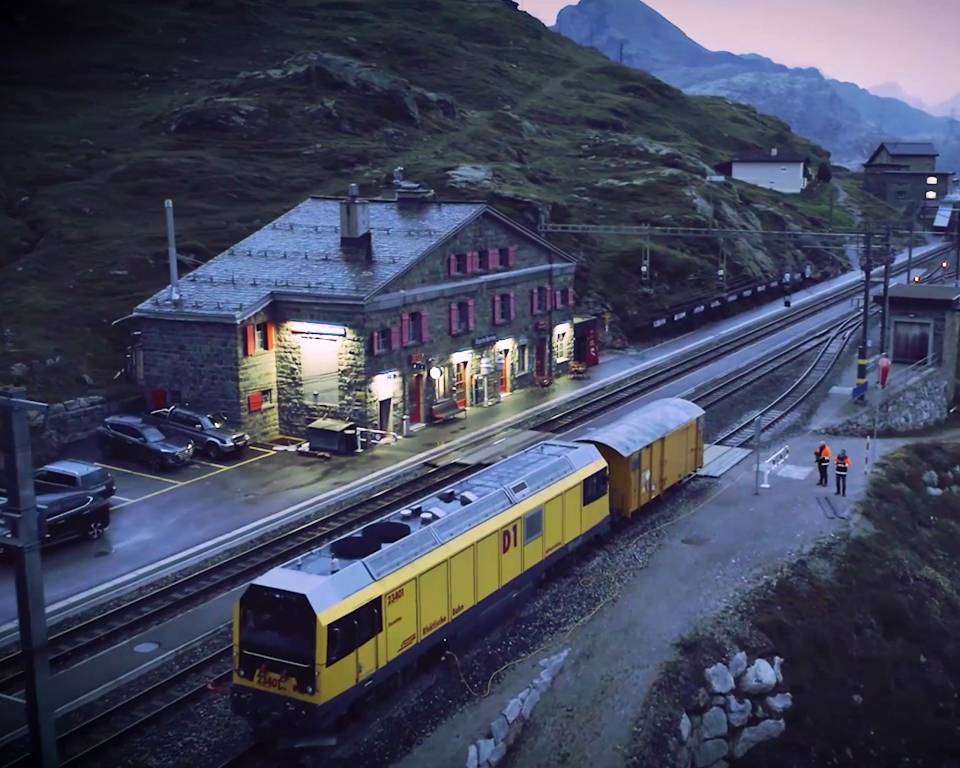 Part of a train in a rural station in the mountains A train at dusk