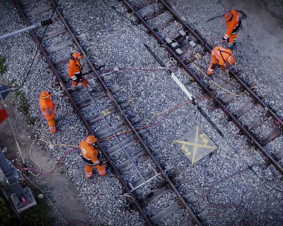 Aerial view of multiple tracks just in front of a station Aerial view of tracks