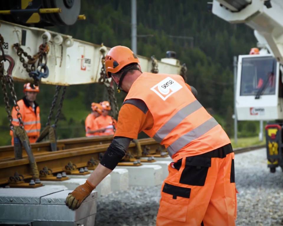 Track workers in high-visibility clothing Sersa workers on the track